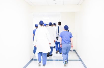 healthcare-leaders-walking-to-surgery-area-at-hospital